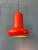 Vintage space age pendant lamp in red/orange colour. The shade is made out of metal and has an red/orange lacquer. The...