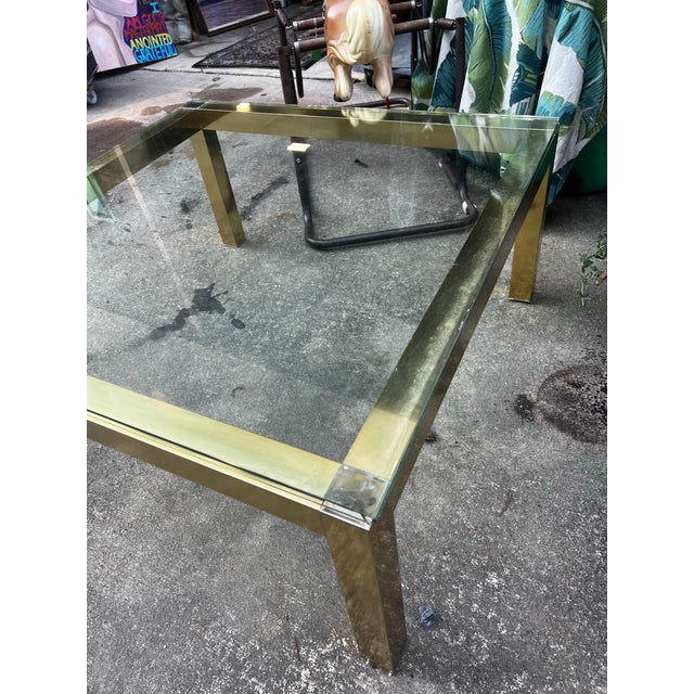 Up for consideration is a beautiful vintage gold square coffee table with a glass top. This would look lovely in your...