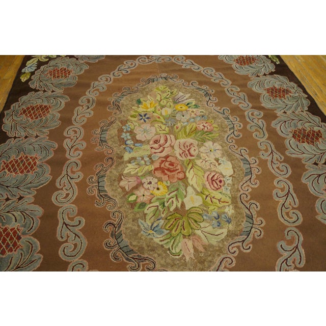 Antique American hooked rug, size: 6'7" x 9'7" Floral pattern with camel color background. Antique American Hooked Wool...
