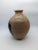 Stunning vase in neutral colors of clay and black. Gorgeous craftsmanship, stunning shape and an extremely tactile finish....