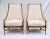 A pair of 1960's Tomlinson Pavane Assemblage Mahogany lounge chairs featuring elegant curved forms of wing back design,...