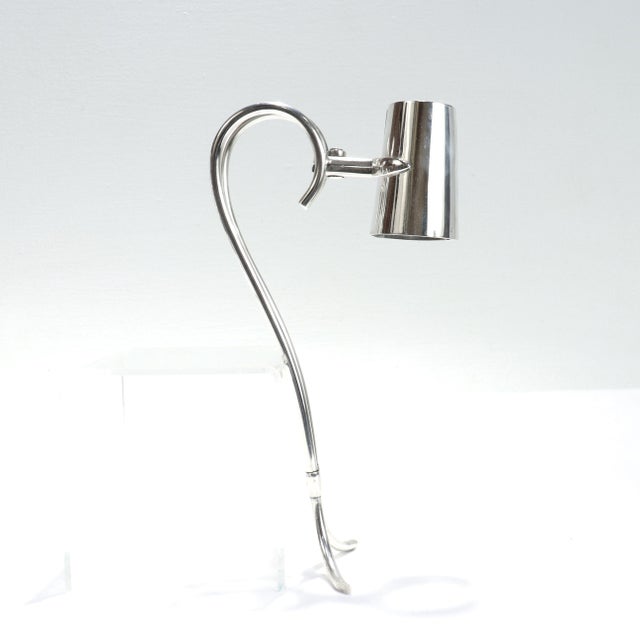 A fine vintage signed bottle holder. By Cartier. In sterling silver. With scissor action and a two-part handle. Fully...