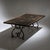 Large rectangular dining table with a long black-painted top featuring hand-painted accents and a patinated Baroque-style...