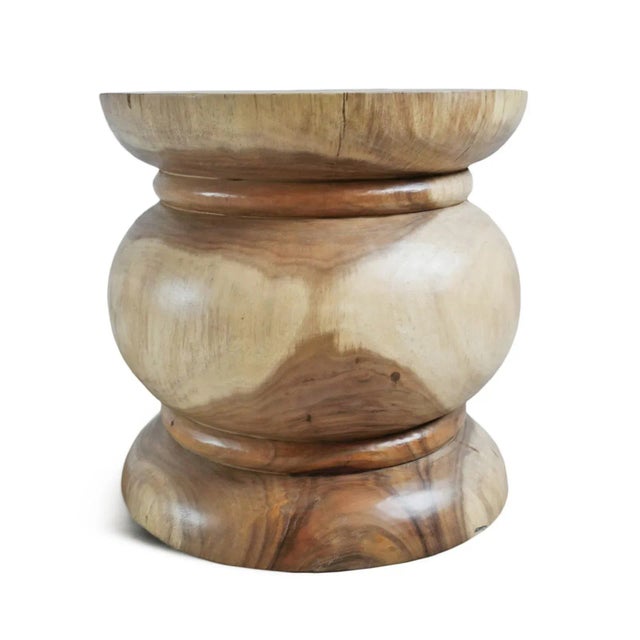Solid hand carved acacia wood rounded side table / stool. Beautiful natural two tone grain with smooth polished finish....