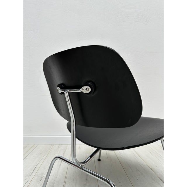 Beautiful vintage lcm lounge chair with black ash plywood shells and chromed metal base. One of the most iconic mid-...