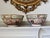 A striking pair of antique Chinese Rose Medallion porcelain serving bowls—the classic famille rose “mandarin palette” with...
