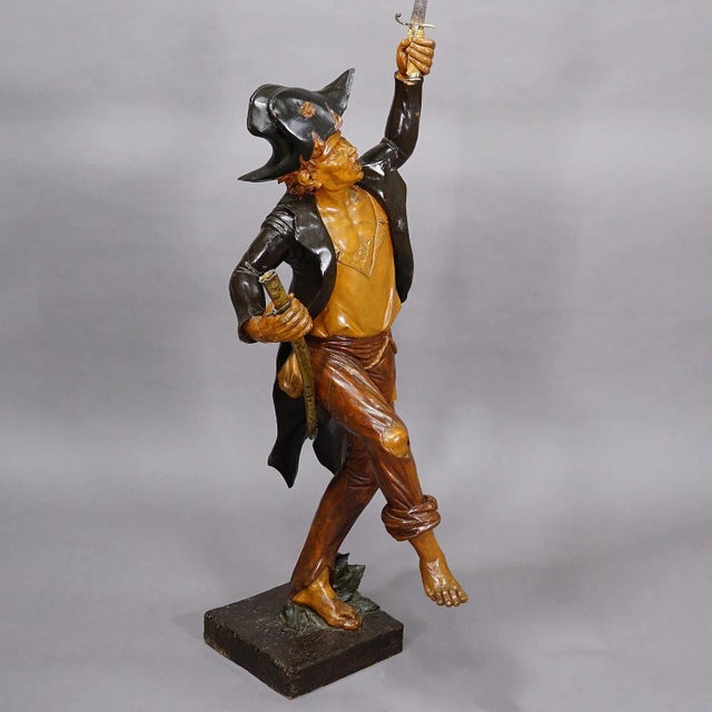 Large Antique Statue of a French Freedom Fighter ca. 1920s A large wooden French freedom fighter statue holding a metal...