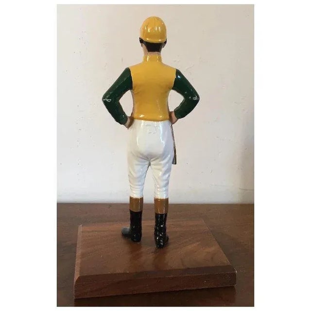 Mid 20th Century Iron Desk Top Statue of a Horse Jockey Dressed in Silks, Cap, Jodhpurs, Boots and Carrying a Riding Crop Mounted on Mahogany Base Door Stop For Sale - Image 5 of 10