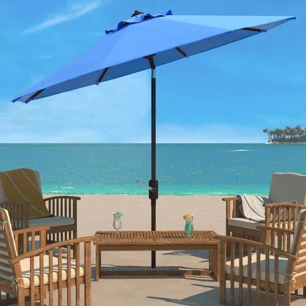 Conjure images of dining al fresco at a romantic café on the Riviera with this Pacific blue Ortega Umbrella. Keep cool on...