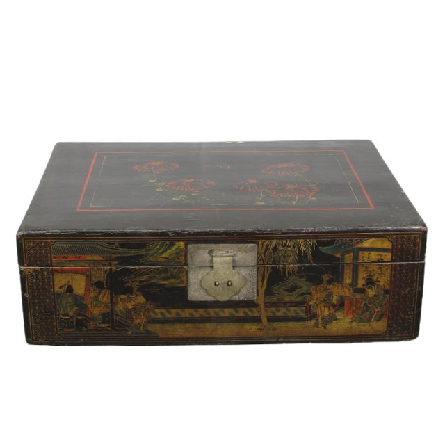 This lovely antique Chinese trunk is adorned by intricate hand-painted artwork that showcases the artistic skills of the...