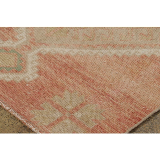 Hand-knotted in wool circa 1950-1959, this 3x11 vintage Turkish runner originating from Turkey is a serene addition to Rug...