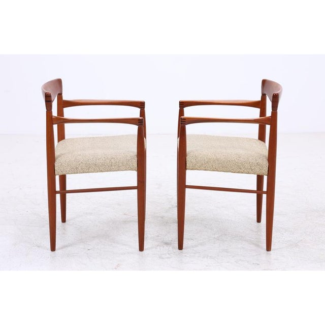 Rare set of two vintage armchairs by Henry W. Klein for Bramin, crafted from warm teak wood with distinctively shaped...