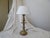 This solid brass candlestick lamp has an old patina, a weathered wood base and looks goo with a 12" Diameter bouillotte...
