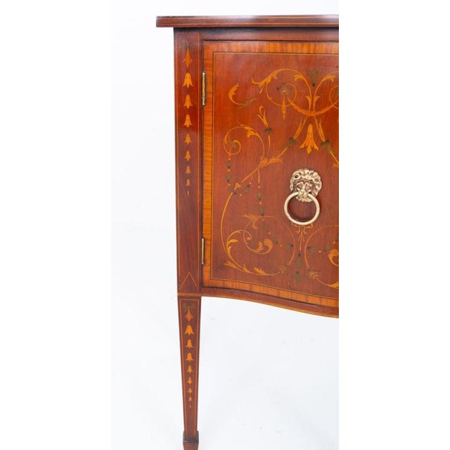 Impressive Sheraton Revival mahogany sideboard This sideboard is of a serpentine form Circa 1880 Raised upon 6 tapered...