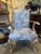 French-style gold gilded armchairs featuring original finish and new upholstery. Intricate carvings of eagles and lions on...