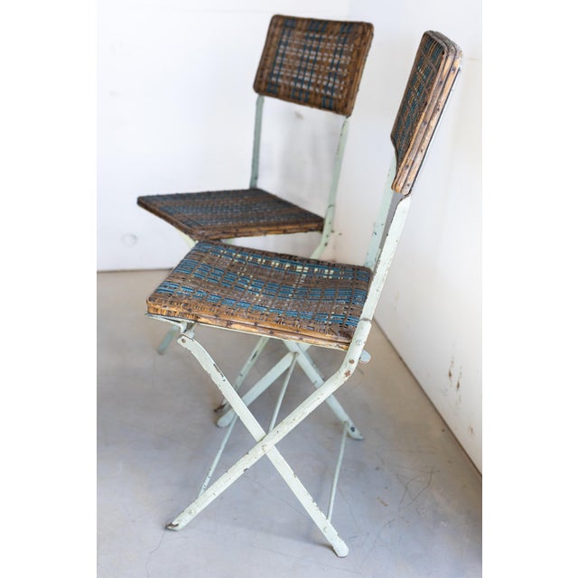 A rare and highly collectible pair of antique French folding chairs by Fabrique de Meubles Mécaniques Guerret, Grenoble—an...