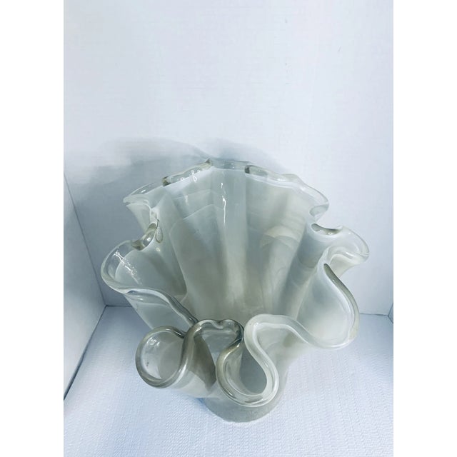 Add a touch of timeless elegance to your space with this stunning vintage Mid-Century Modern Murano glass vase. Expertly...