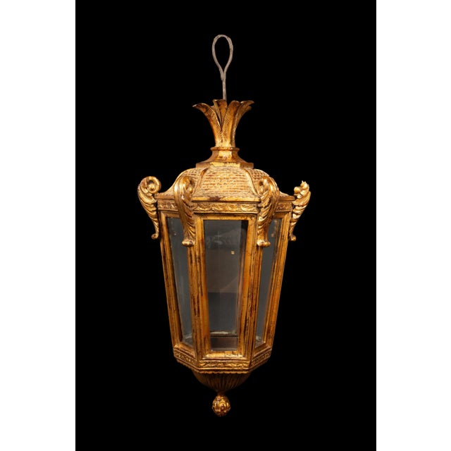 Exquisite 19th Century Carved and Gilt Wood Venetian Lantern. Crafted with meticulous artistry, this lantern's intricate...