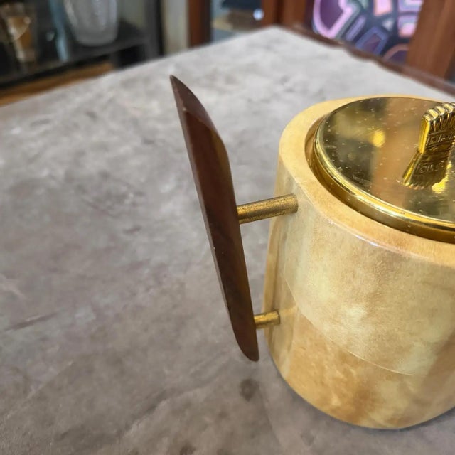 This authentic 1950s Aldo Tura ice bucket is a quintessential example of Italian Mid-Century Modern luxury, featuring the...
