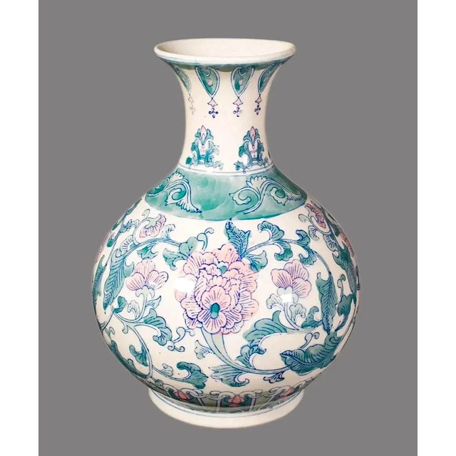 Vintage Chinese porcelain baluster vase. It features a baluster shape, characterized by a rounded body, a narrow neck, and...