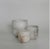 The Luce Tealight Holder by Michael Verheyden highlights the soft, translucent beauty of alabaster, casting a warm,...