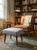 Elevate your space with this classic piece of mid-century design. This versatile footstool features beautifully sculpted,...
