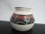 Small Native pottery vase, glazed, in white with tones of brown geometric design. Indecipherable signature at base....