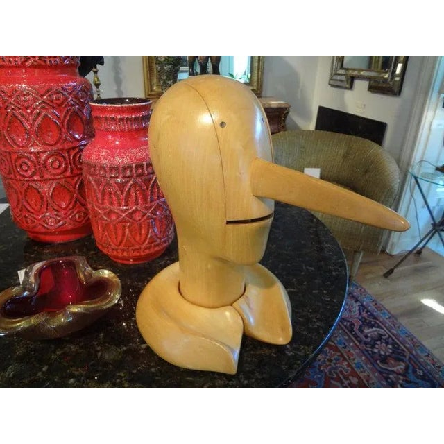 Charming vintage carved wood Pinocchio sculpture. This interesting bust of Pinocchio is well made with a mouth that opens...