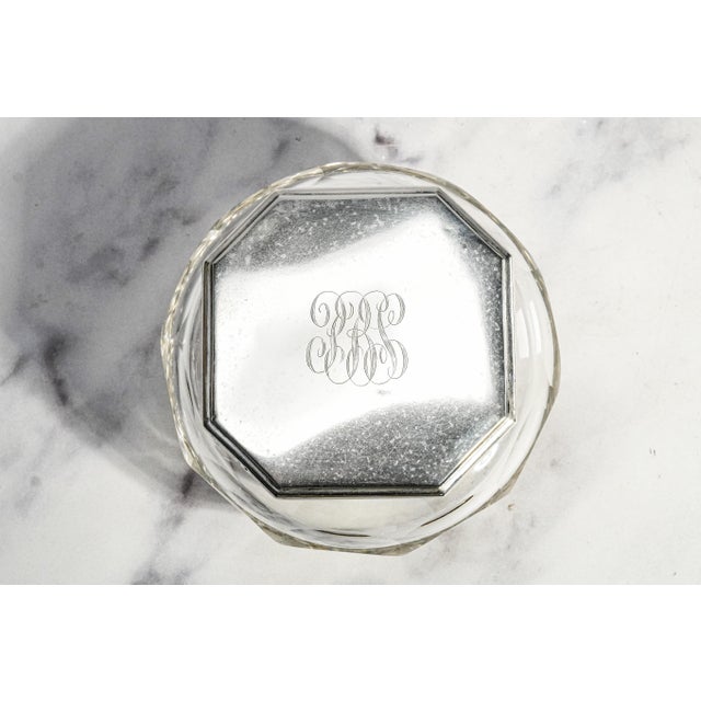 A beautiful example of 1920s elegance, this antique crystal powder jar perfectly captures the refined craftsmanship of the...