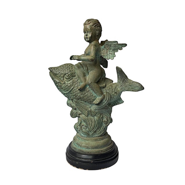 This is a substantial 20th-century Continental cast bronze fountain or garden sculpture depicting a winged putto astride a...