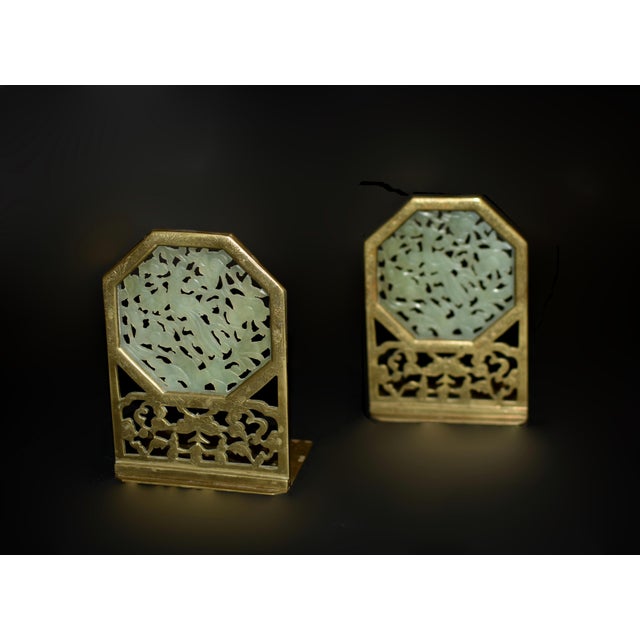 This exceptional pair of antique Chinese bookends showcases the beauty of gemstone green jade and the craftsmanship of...