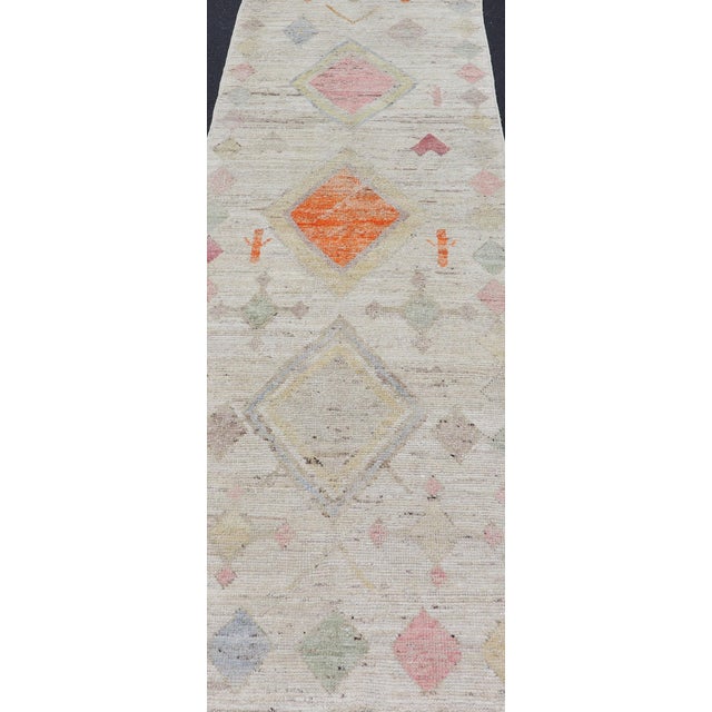 Afghan Tribal designed runner in cream and vivid color palette and all-over flower design, rug AFG-36124, Keivan Woven...