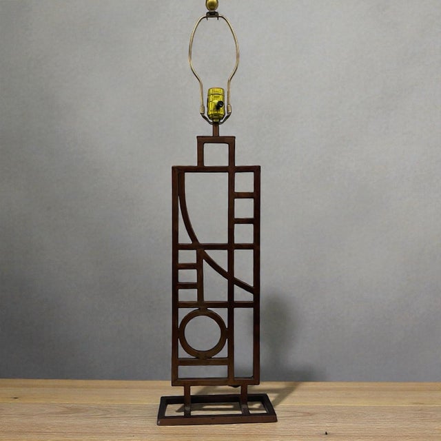 Vintage table lamp designed by Robert Sonneman for George Kovacs. Copyright dated 1987. Metal openwork base with geometric...