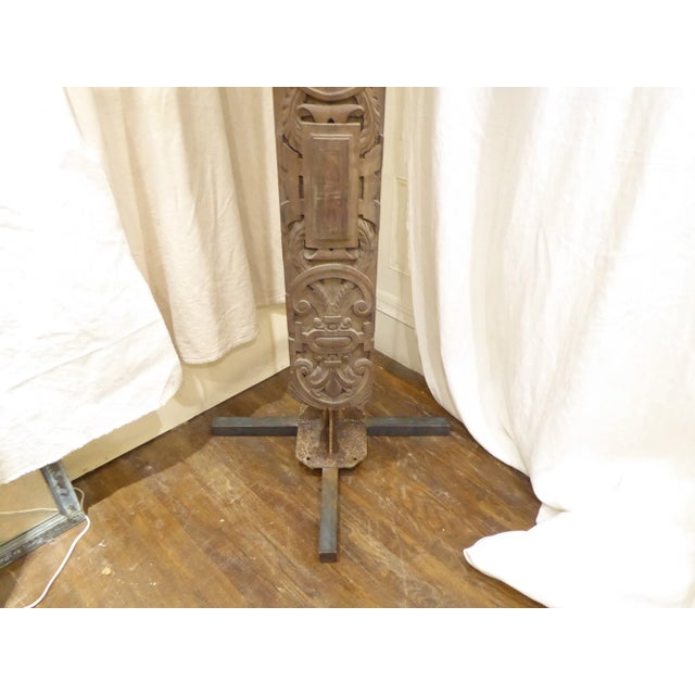 19th Century Continental carved architectural effect mounted later on iron stand, the base of the stand measures 24 x 24,...