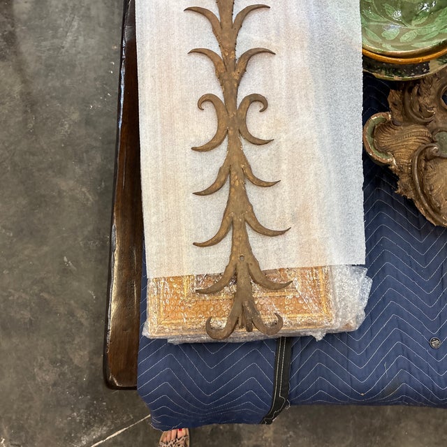 This is a hand-forged iron architectural element from the mid 20th century, Spain. This decorative rack was likely...