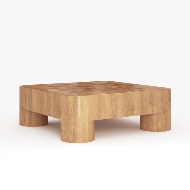A chunky coffee table that looks as solid as the solid Oak wood it's made of, but with a delicate Marquetry top in...
