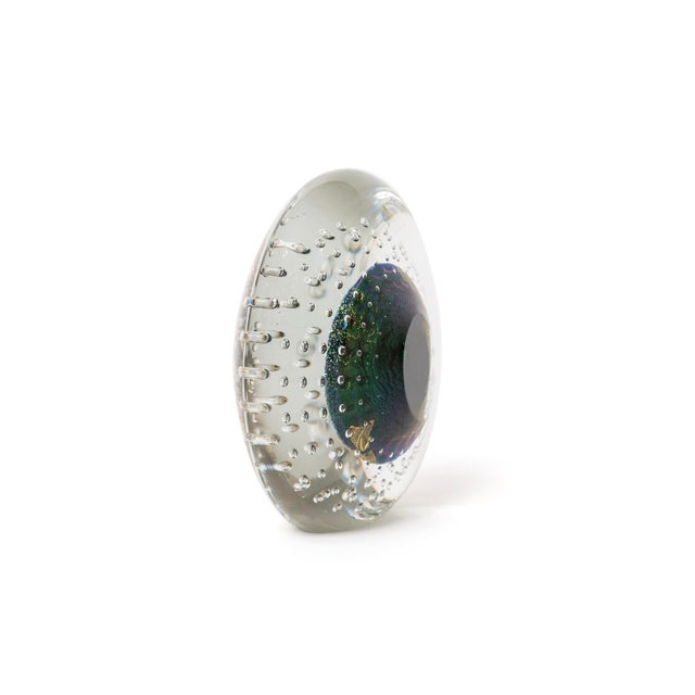 A striking hand-blown studio art glass paperweight from Robert Eickholt’s sought-after Cosmic Series, signed and dated...