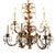 Vintage Italian 9-arm gilt tole chandelier with crystal drop prisms. Features gold leaf floral bobeches, curling acanthus...