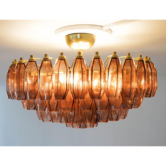 This prismatico glass chandelier in amethyst is the compact version of the prismatico collection, featuring 91 blown glass...