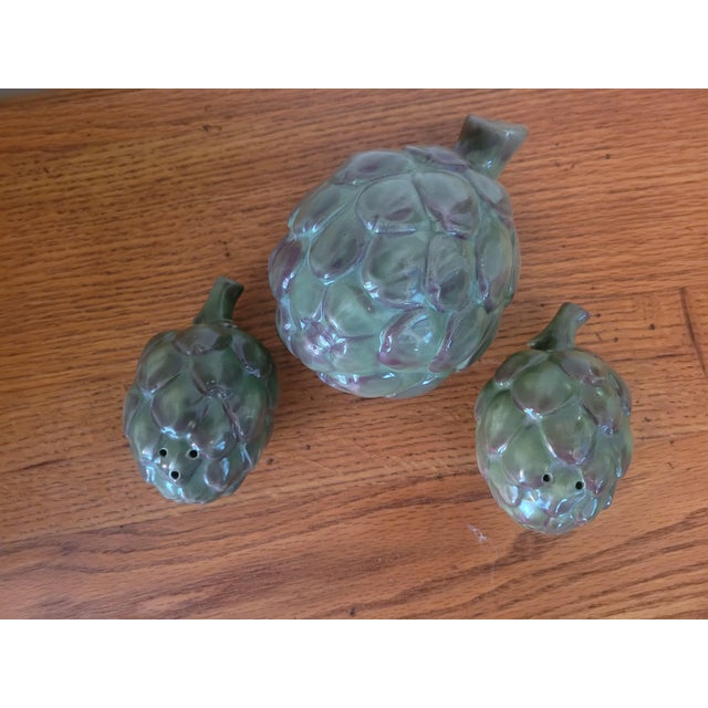 This pair of salt & pepper shakers are in excellent condition. There are no chips, cracks, or any damage at all. Included...