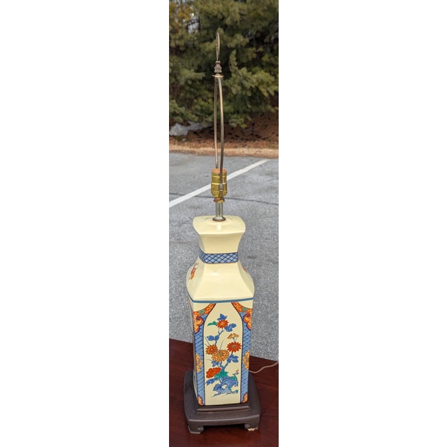 Japanese inspired hand painted floral porcelain lamp on a dark brown base