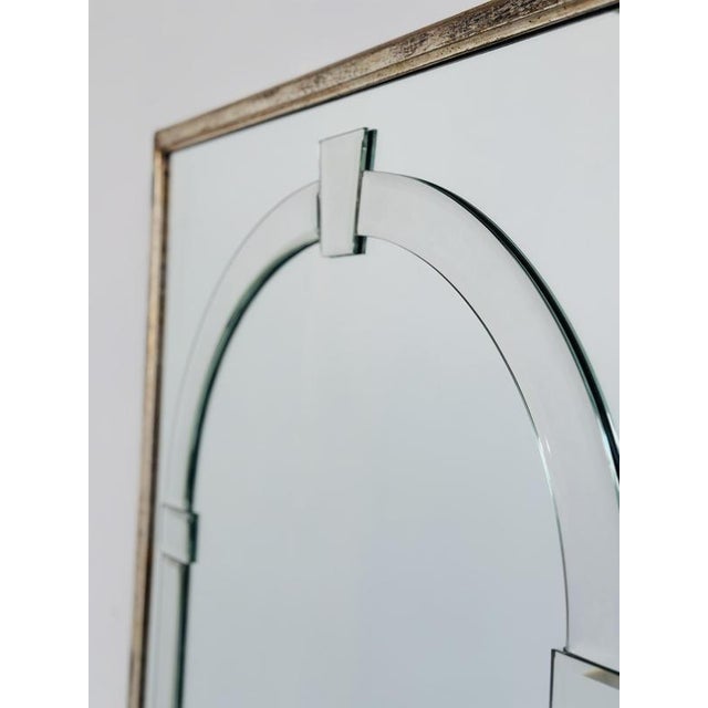 Height: 116 cm / 45.7 in Width: 75 cm / 29.5 in Depth: 2 cm / 0.8 in A striking large decorative wall mirror with a strong...