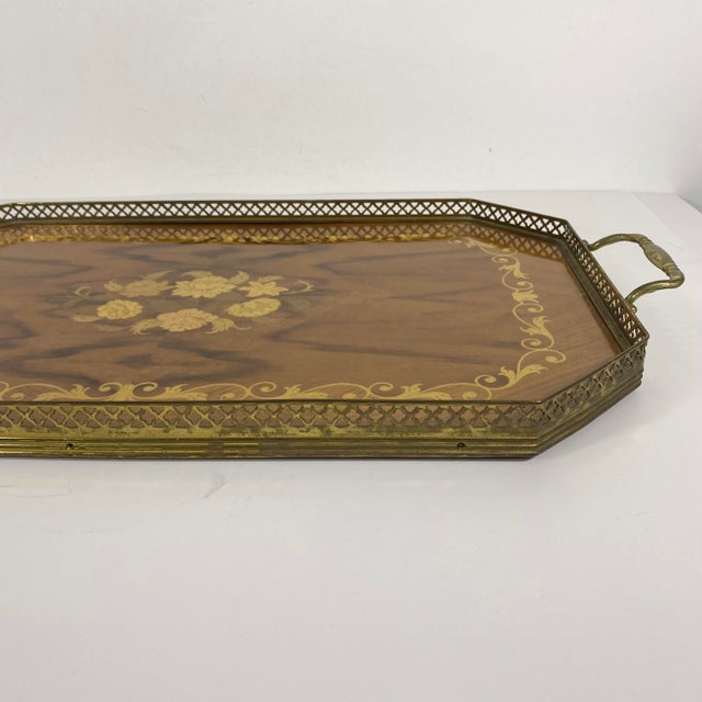 Gorgeous, large vintage Italian wood marquetry serving tray. This has an inlaid floral and scroll pattern and a brass edge...