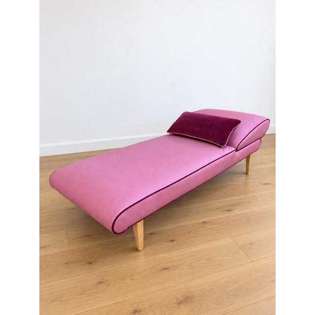 Mid Century Modern Chaise w/ adjustable head rest. Newly upholstered in pink leather and accent with cherry colored mohair...