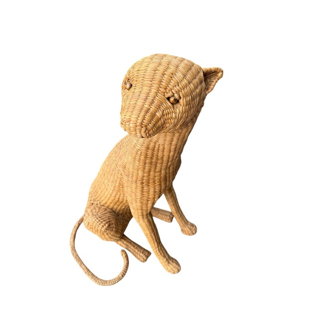 A hand woven rattan cheetah figure by Mario Lopez Torres, Mexican furniture designer and artist. This piece is in great...