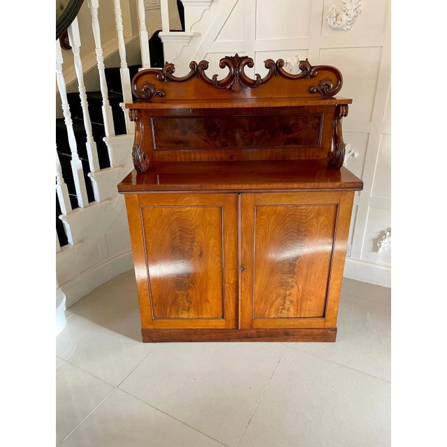 Antique victorian quality carved mahogany sideboard having a quality carved mahogany shaped pediment over a shelf...