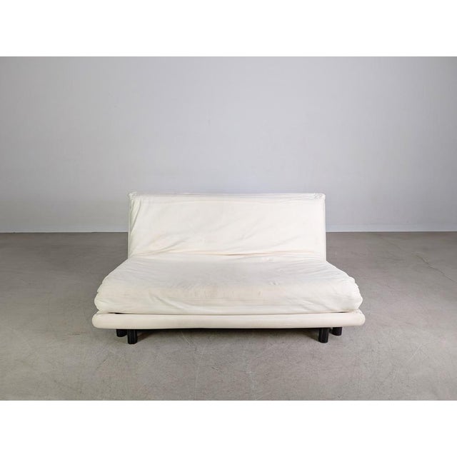 True design classic for sale: the Ligne Roset Multy two-seater sofa. The sofa features a white/very light-colored cover...
