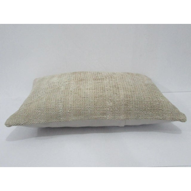 Decorative pillow cover made from a vintage Turkish handknotted rug. Backed with good quality cotton fabric. Pillow...