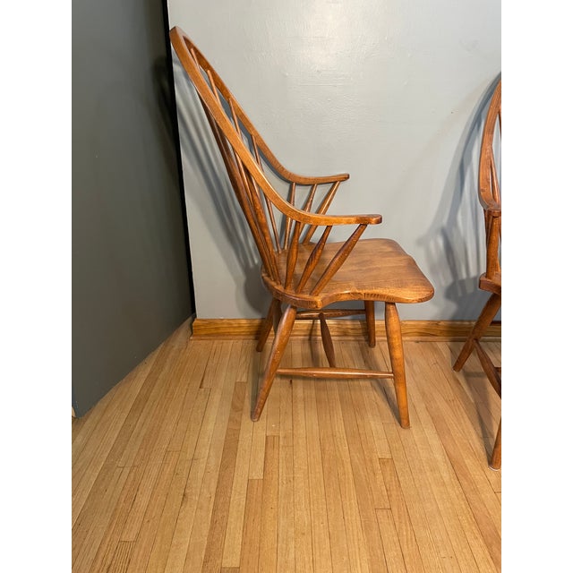 A set of two continuous arm Windsor Chairs in solid red maple with high barrel back, made in Slovenia. Great vintage...