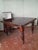 A square-formed victorian extending dining table, likely crafted from maple leaf wood on oak, (likely because i am not a...